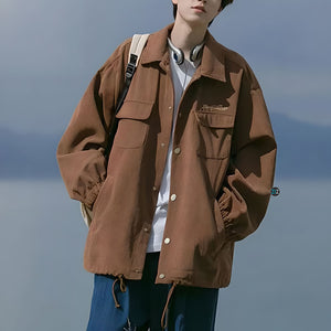 Áo khoác Nam Nữ Jacket sơ mi màu nâu đất, phong cách oversized thoải mái, có túi trước và dây rút điều chỉnh tạo nét độc đáo