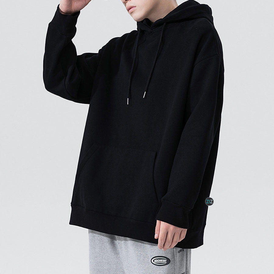 Áo Hoodie màu đen oversize unisex nam nữ, dễ phối đồ với quần jogger, có túi trước và mũ trùm phong cách đường phố chất lừ