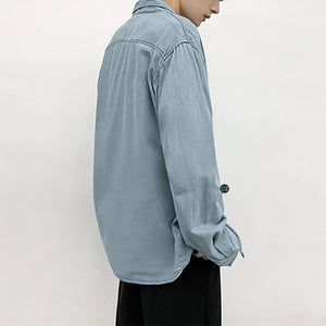 Áo sơ mi jean oversize phong cách streetwear, chất liệu denim bền bỉ, túi trước tiện lợi, tạo điểm nhấn phong cách trẻ trung