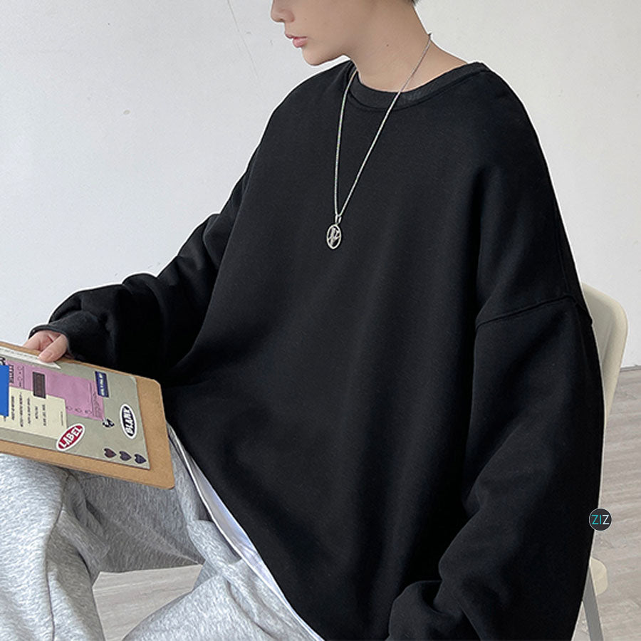 Thiết kế áo sweater rộng rãi, màu đen cơ bản, vải mềm mát mặc thoải mái, phong cách unisex streetwear, mặc đi học đi chơi