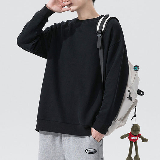 Áo Sweater nam nữ màu đen phom rộng, cổ tròn dài tay, vải nỉ da cá mềm, phong cách streetwear thoải mái và dễ dàng phối đồ