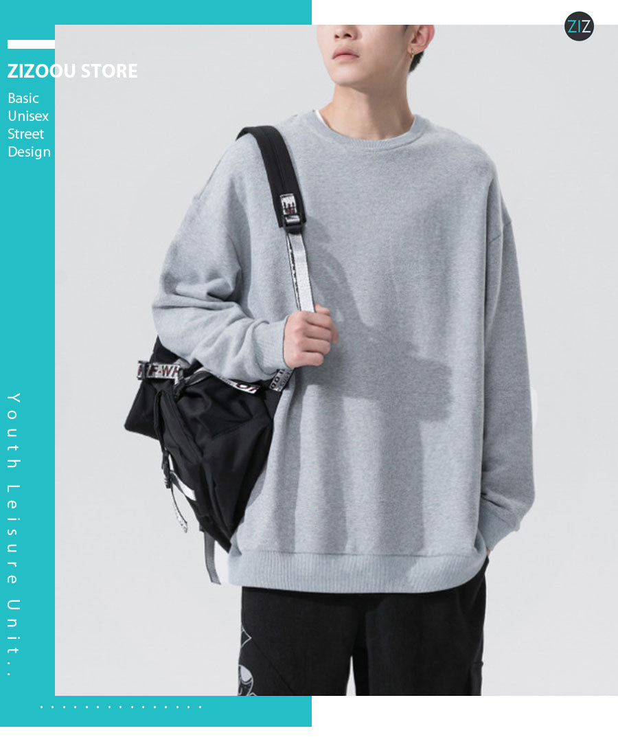 Áo sweater trơn form rộng màu xám, bo cổ tay và lai áo nhẹ nhàng, chất liệu co giãn và thoáng khí, tạo cảm giác thoải mái